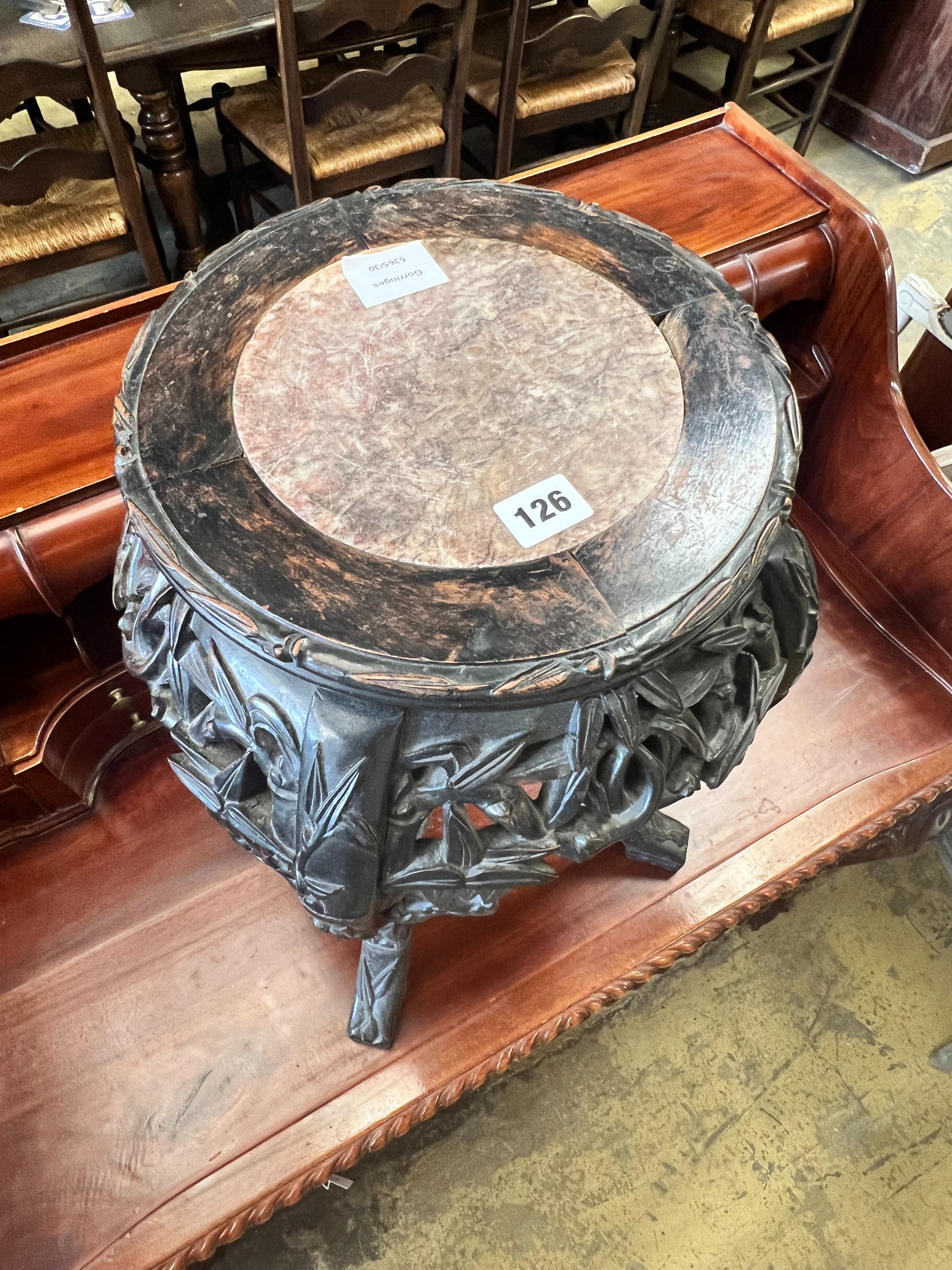 A Chinese carved hardwood circular marble topped vase stand, width 32cm height 47cm